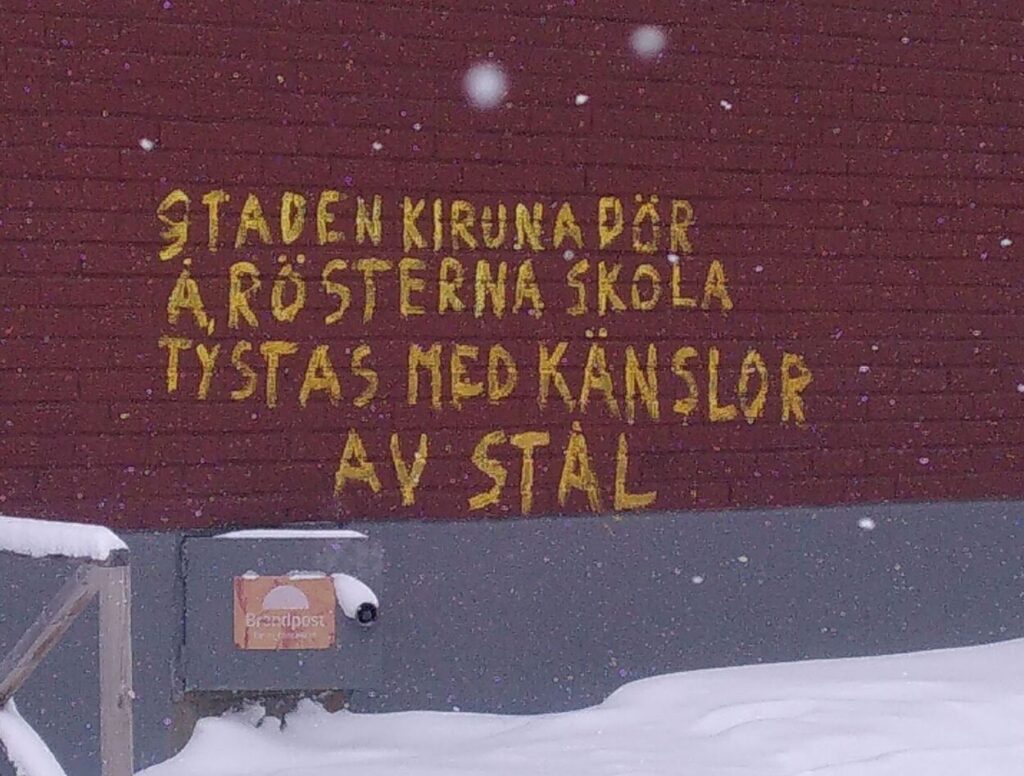 Graffiti in the old Kiruna saying "The city of Kiruna is dying and the voices shall be silenced by feelings of steel". Photo by L. Patrouix